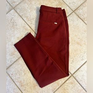 White House Black Market the Slim Ankle pant. 
Size 4, maroon, EUC.